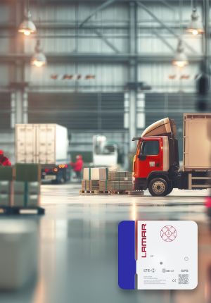 A white and blue Lamar asset tracking device with 5G, LTE-M, NB-IoT, and GPS labels, shown in the lower corner against a blurred warehouse loading dock with a red truck.