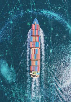 Aerial view of a container ship cutting through blue water, overlaid with a digital network of glowing lines and data points representing connectivity.