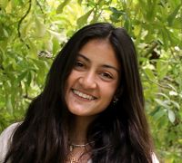 Young smiling woman with long dark hair