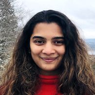 Smiling young woman with long dark hair